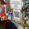 Quét mã QR: Nơi nghiêm túc, chỗ thờ ơ
