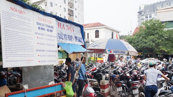 Xử lý nghiêm điểm trông xe phá giá ảnh 1