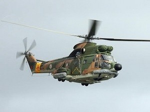 Trực thăng quân sự bị tấn công khi đang cứu hộ ảnh 1