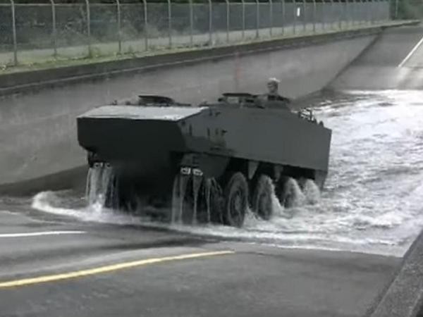 Nhật Bản công bố xe bọc thép chở quân mới ảnh 1