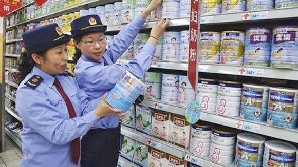 Trung Quốc phạt nặng công ty “làm giá” sữa ảnh 1